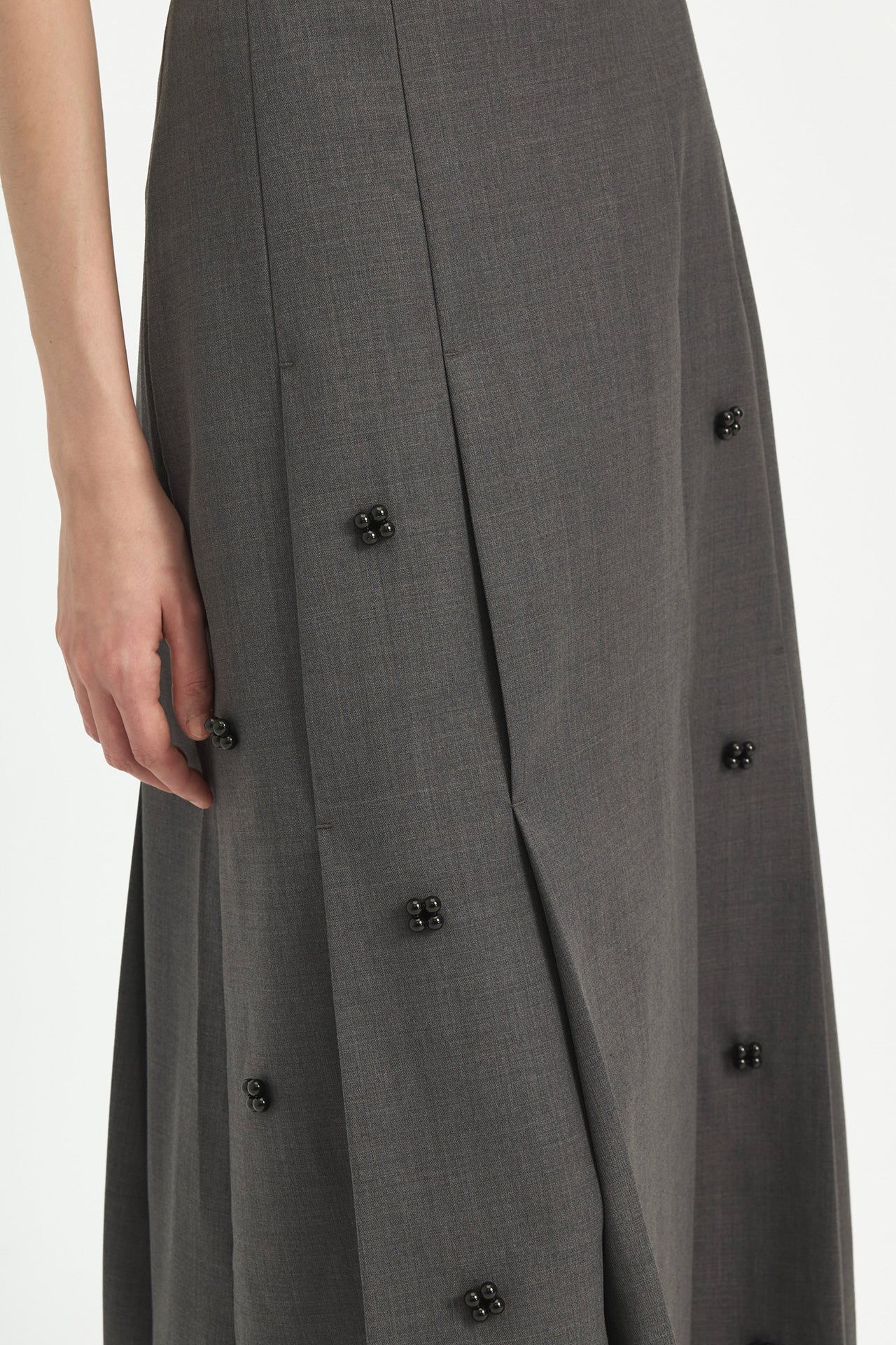PLEATED SKIRT WITH BEADED EMBELLISHMENTS